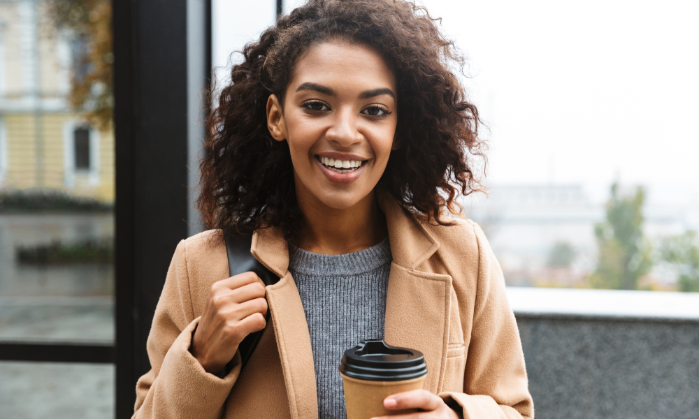 Hispanic college student on her way to her early career program for college students, recent grads, grad students, freshmen, sophomore, juniors, seniors, HBCU students, African American students, college conferences, networking, career exposure