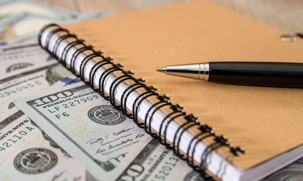 Part-time Jobs that you can work from your dorm room, easy money, flexibility, remote work, notebook, pen, and money on desk