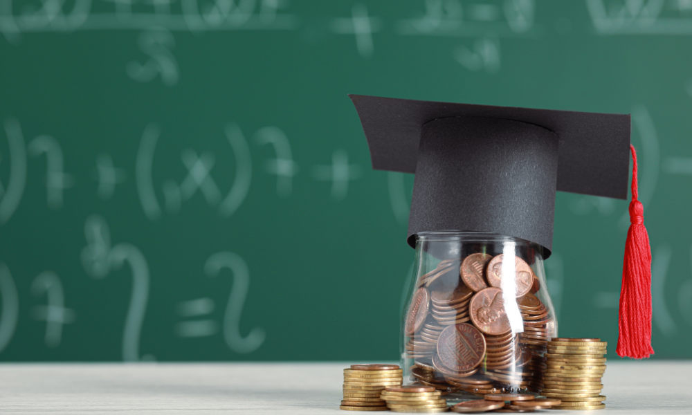 A money jar filled with college savings, with a graduation cap on top in front of a chalk board, February scholarships for people of color, BICOP students, underrepresented populations, underrepresented students, academic excellence, graduate school. professional programs, medical school, grad programs, graduate programs, undergraduate programs. computer science, academic achievement, Latinx, Hispanic student, minorities