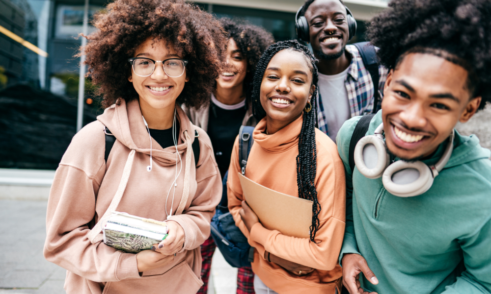 Hispanic/Latino and African American/Black college students talking on their college campus, Hispanic serving institutions, McDonald's Hacer scholarships, UNCF scholarships, TMCF scholarships, Thurgood Marshall College Fund, NAACP, merit scholarships, need-base scholarships, first-gen scholarships, 1st generation, Minority scholarships with February deadlines