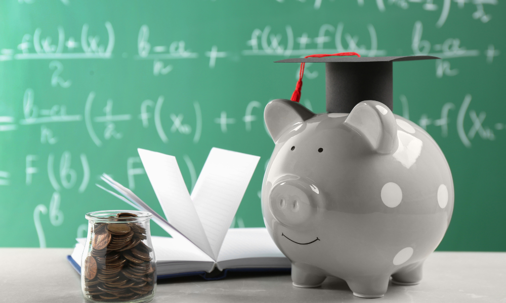 A piggy bank with a graduation cap and a jar of scholarship money won from April Scholarships