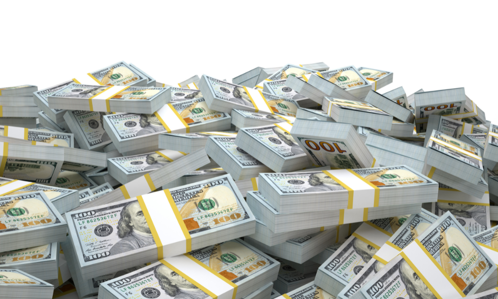 Bundles of dollars bills, scholarship money, female student, may deadlines, scholarships with upcoming deadlines, letters of recommendation, list of scholarships