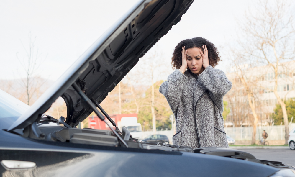 A recent grad car stopped on the side of the road, student loans, better deal, car ownership, high prices, hard work, large suvs, good mechanic, regular maintenance, price range, lower price tag, insurance rates, young people, car-buying process