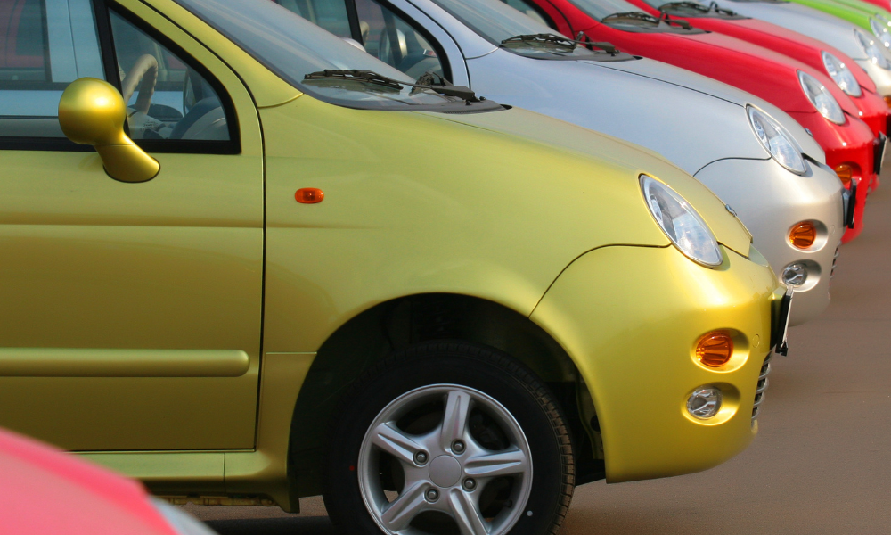 Various color cars on a car dealership lot, dream car, family car, used car, monthly payment, test drive, personal finance