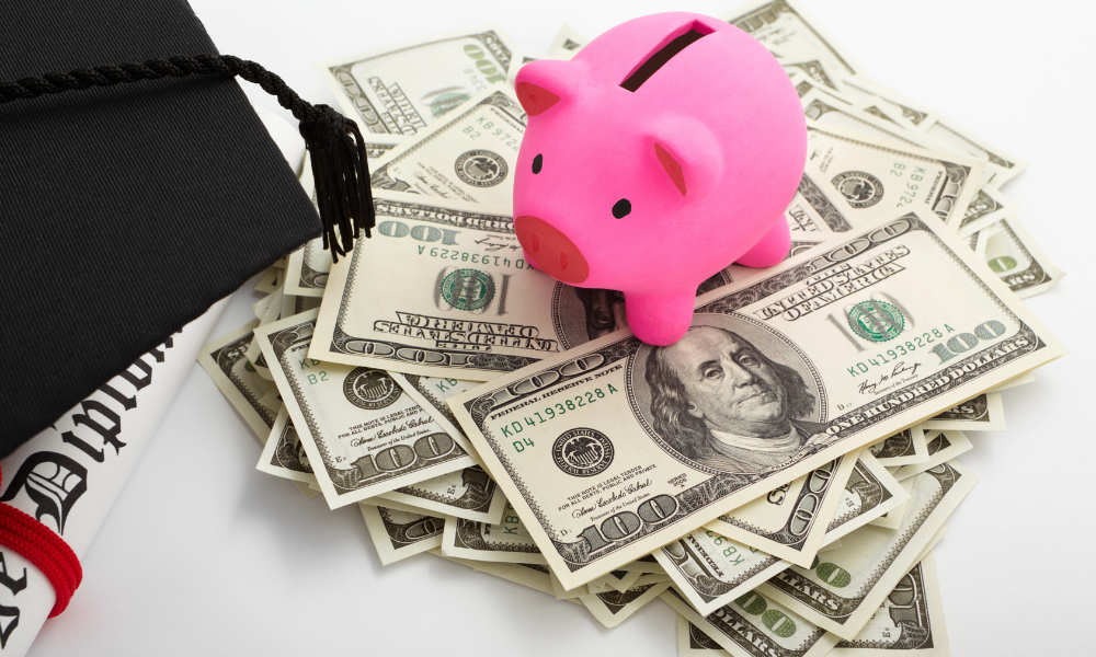 A piggy bank on top of a wad of scholarship money for high schoolers, higher education, technical school, years of age, graphic design, private institutions, april deadlines, international students, high schoolers, inspiring service project, community college, trade school, college scholarships, financial assistance, following criteria, high school juniors, college freshman
