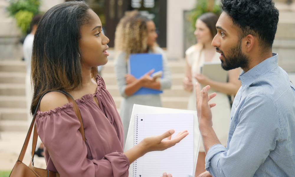 Two graduate school students talking on their college campus, eligibility requirements, international students, higher education, letter of recommendation, interested students, alumni scholarships, advanced certificate, cost of tuition, us citizens, current undergraduate students, scholarships with June deadlines, grad scholarships