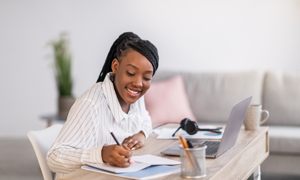 A high schooler is spending her summer break applying to summer scholarships for high school juniors, scholarship opportunities, undergraduate degree, degree program, trade school, vocational school, certificate program, incoming freshmen, graduate students, grad students, HBCU scholarships, HBCU students, African American students, Black students