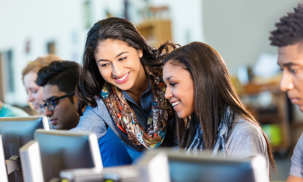 A high schooler getting help in class, college scholarships. community service, computer science, accredited college, related field, good character, positive impact, technical colleges, community involvement, following criteria, June Scholarships for High School Students, scholarships for incoming freshmen, high school seniors, college bound seniors, graduating seniors