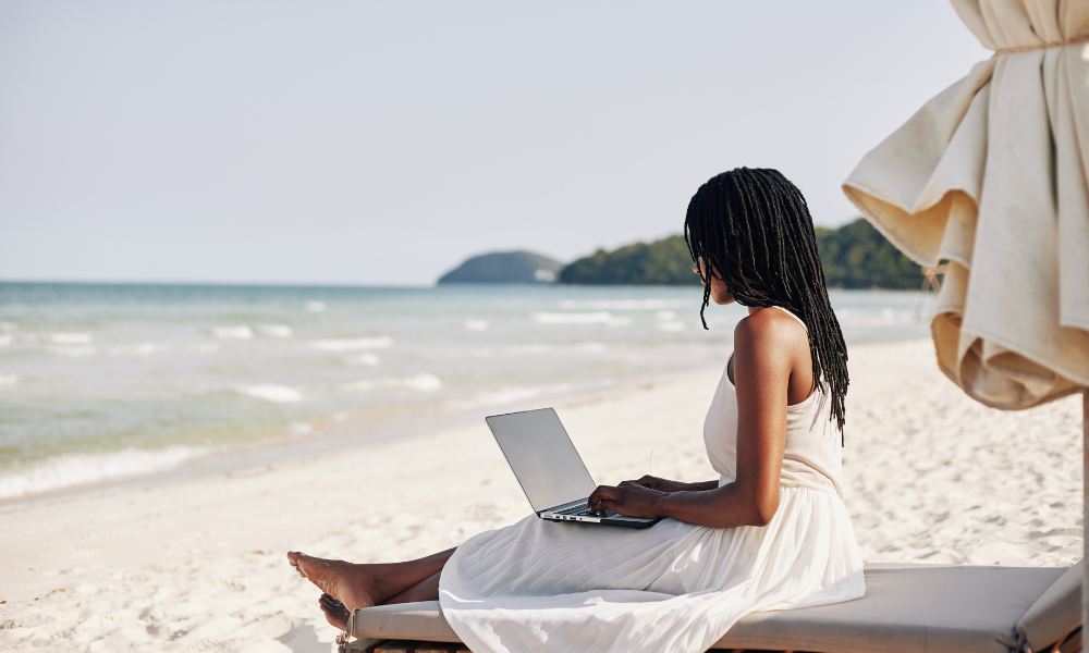 College student at the beach looking for scholarships with July deadlines on her laptop, Pacific Islanders, Pacific Islander students, Alaska Native students, African American students, Black students, Hispanic students, Latinx students, Asian students, graduating high school senior, scholarship application process, specific majors, STEM, females in STEM, female scholarships, HBCU scholarships, minorities, personal statement, award amount, graduate students, essay scholarship, free application