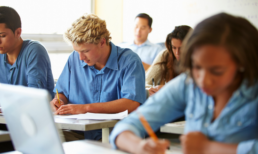 High school students take notes during a class lecture, extracurricular activities, female students, high school graduates, college education, merit-based scholarships, junior college, test scores, letter of recommendation. high school scholarships, scholarships due in June