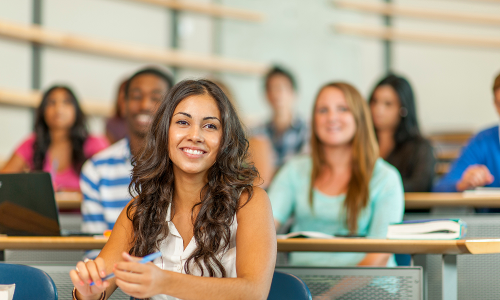 A college student is sitting in class listening to a lecturer while looking for a list of scholarships. She wants to apply to October scholarships for undergraduate students and for graduate school. She is hoping she has not missed the scholarship deadline and that she meets the specific criteria