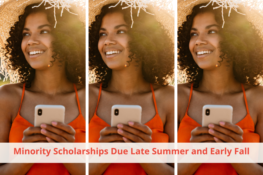 A college student at the beach looking on her cell phone for Minority Scholarships Due Late Summer and Early Fall