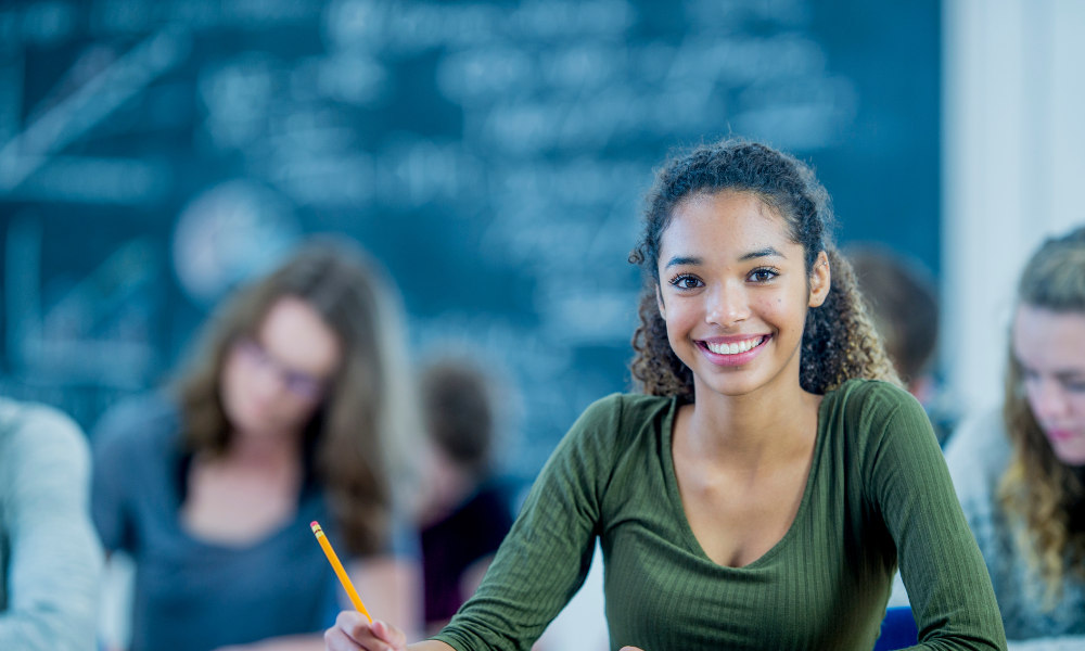 The high school senior is sitting at a table in the library and she is looking for scholarships with upcoming deadlines. She needs financial assistance but does not want student loans. She wants to apply to October scholarships for incoming freshman students.