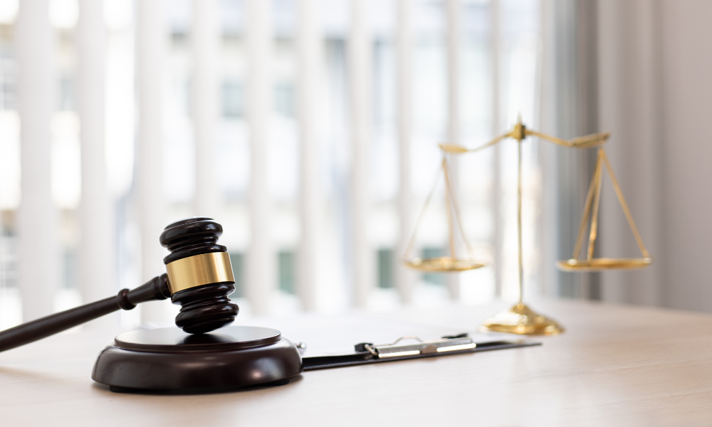 A judge gavel on top of a planner, graduate degree, u.s. citizen, application process, admitted students, full time students, good standing, scholarship opportunities
