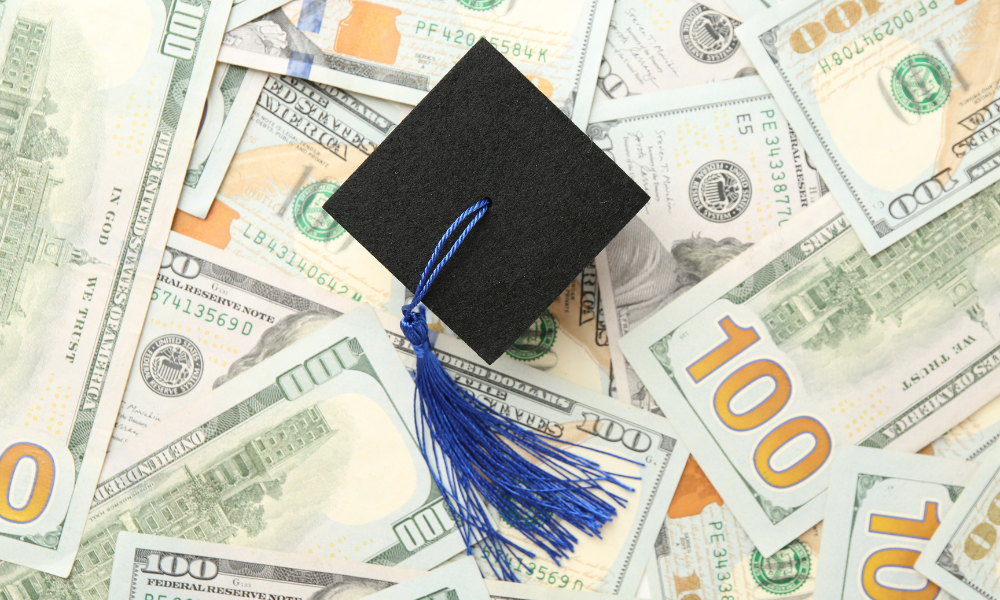 A graduation cap sitting on top of a pile of scholarship money, January scholarships, freshmen scholarships, college scholarships, scholarships due by late January, scholarships for minority students, scholarships for African American students, Latino scholarships