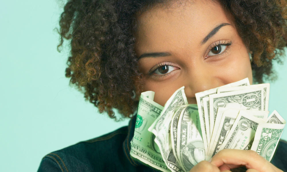A graduate student is showing the money won from applying for graduate school scholarships with June deadlines. Scholarships for females, scholarships for Black students, scholarships for Latino students, master's scholarships and Ph.D scholarships and fellowships