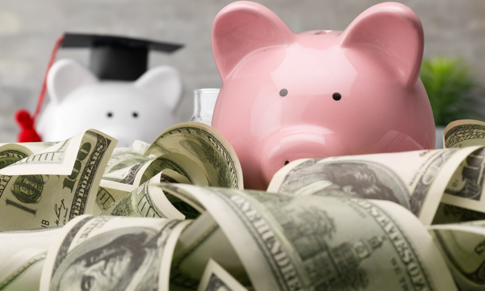 Piggy bank on top of a bed of scholarship funds from scholarships with summer deadlines, scholarships with June deadlines, scholarships with July deadlines, scholarships with August deadlines