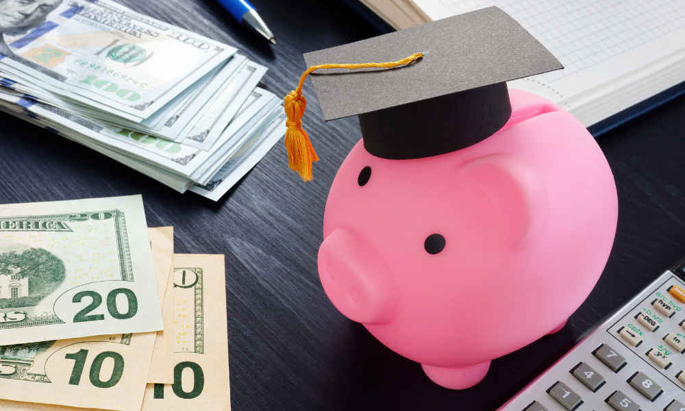 A piggy bank next to a pile of scholarship money for Black students, African American students, high school seniors, college seniors, college sophomores, college juniors, incoming freshmen