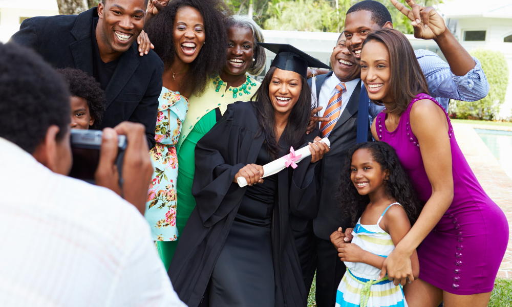 African American female is graduating and is surrounded by her family, applying to law school, applying to business school, MBA program, academic achievement, graduate school scholarships due in November, graduate school scholarships to apply for in November, graduate school scholarships with winter deadlines