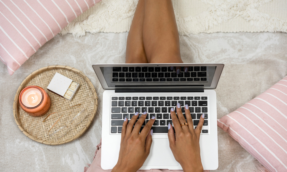 A college student is sitting on her dorm room floor completing an application for the community foundation of northeast Alabama. Each community foundation has it's own eligibility requirements and individual donors.