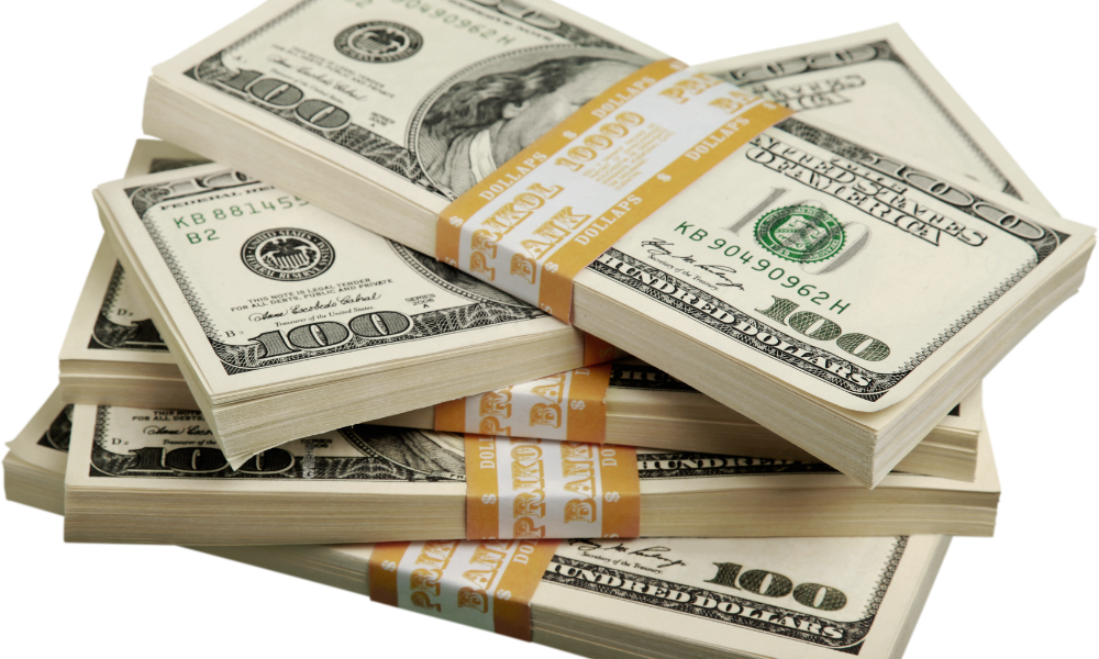 A stack of scholarship money won from the Kalamazoo Community Foundation scholarship and from other community foundations with multiple scholarships