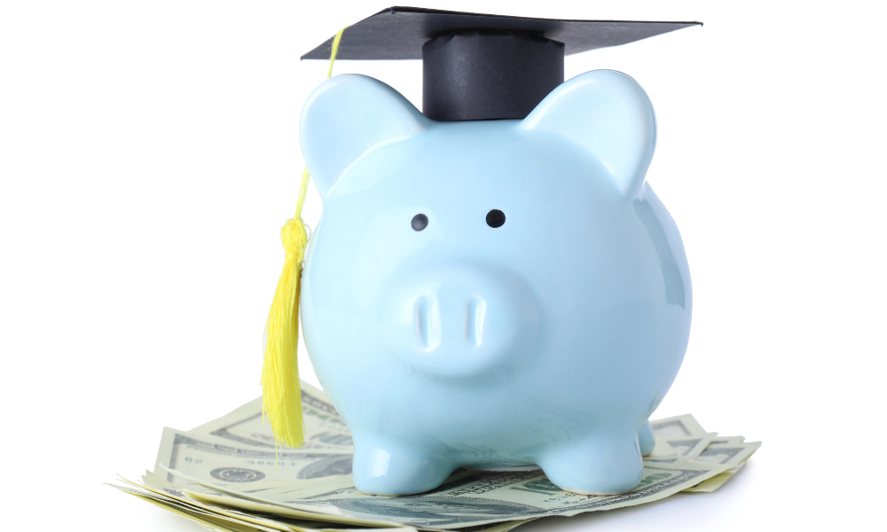 A piggy bank has on a graduation cap and sitting on top of wads of money that was won from May scholarships. The high school senior is having her counselor and her English teach write a recommendation and she is requesting her most recent unofficial transcript