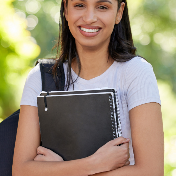 A college student walking across campus with her books and bookbag, Scholarships to Apply for by Late May, May scholarships