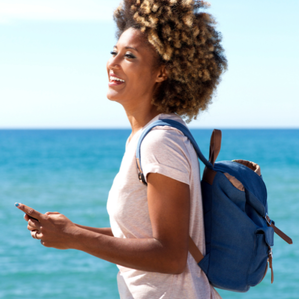 A college student at the beach with her book bag, credit hours, additional information, letter of recommendation, pell grant, student loan, summer scholarships, june scholarships, high school seniors, graduating seniors