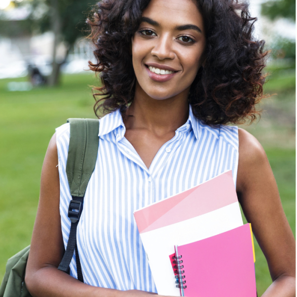 A female student walking across campus to the library to apply for African American scholarships due in August, scholarships with upcoming deadlines, scholarships with summer deadlines