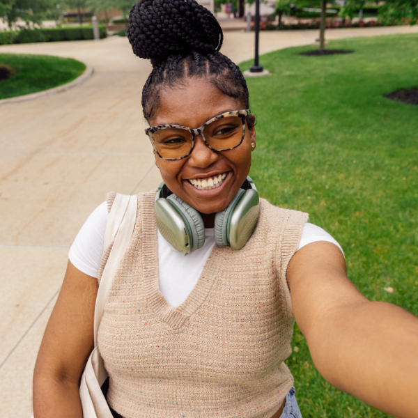 Female college taking a selfie in the middle of campus, STEM scholarships, college money, money for college, student loans, pell eligible, financial need, graduate degrees, minimum gpa, u.s. citizens, permanent residents, letters of recommendation, full-time students, part-time students, winter scholarships, November scholarships, scholarships awards, scholarship opportunities, short essay, undergraduate students, high school graduates, high schoolers, high school seniors, college bound