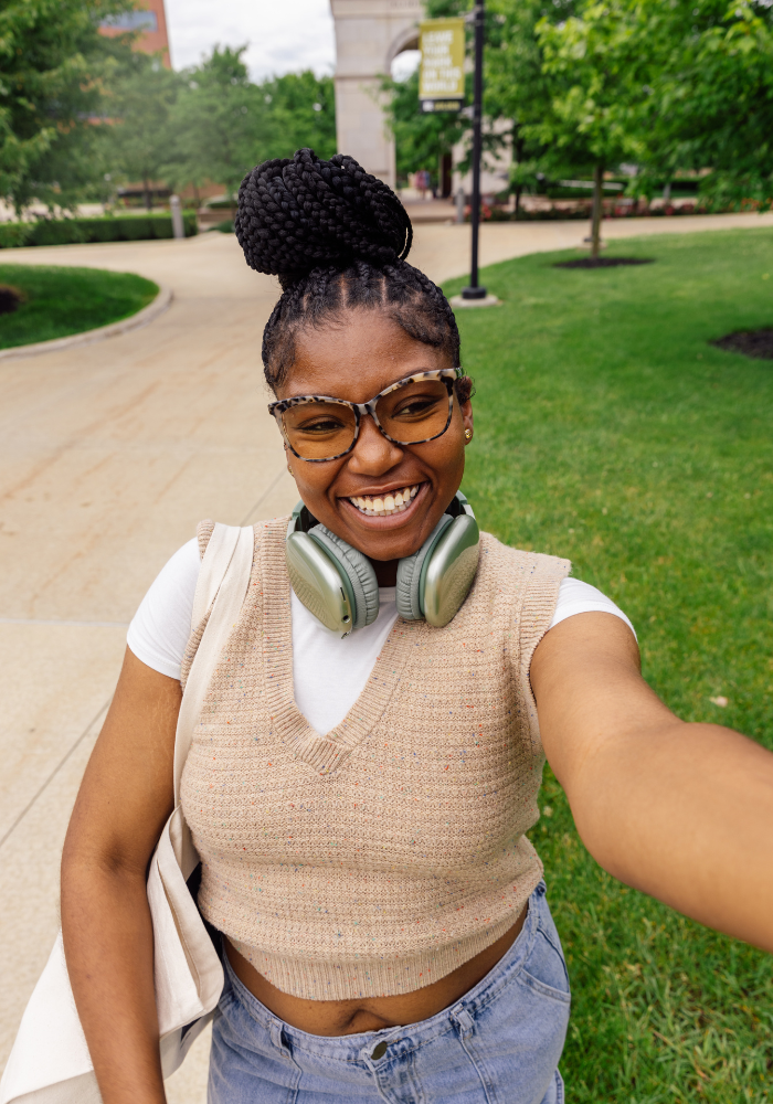 Female college taking a selfie in the middle of campus, STEM scholarships, college money, money for college, student loans, pell eligible, financial need, graduate degrees, minimum gpa, u.s. citizens, permanent residents, letters of recommendation, full-time students, part-time students, winter scholarships, November scholarships, scholarships awards, scholarship opportunities, short essay, undergraduate students, high school graduates, high schoolers, high school seniors, college bound