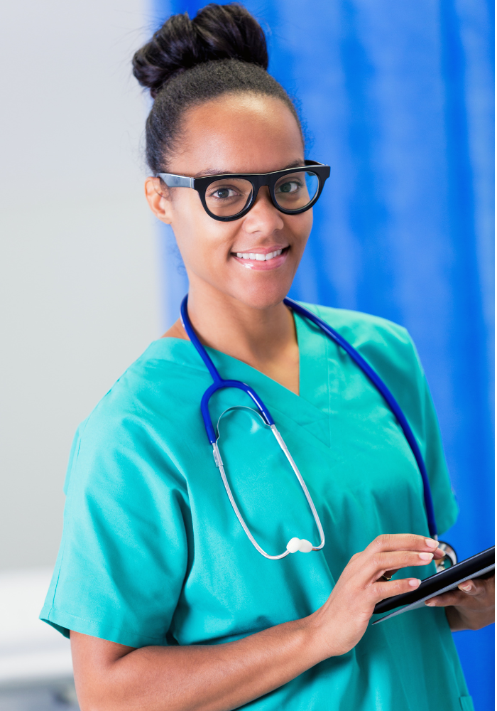 An HBCU student is dressed in scrubs for her nursing program is is searching for Nursing scholarships with summer deadlines