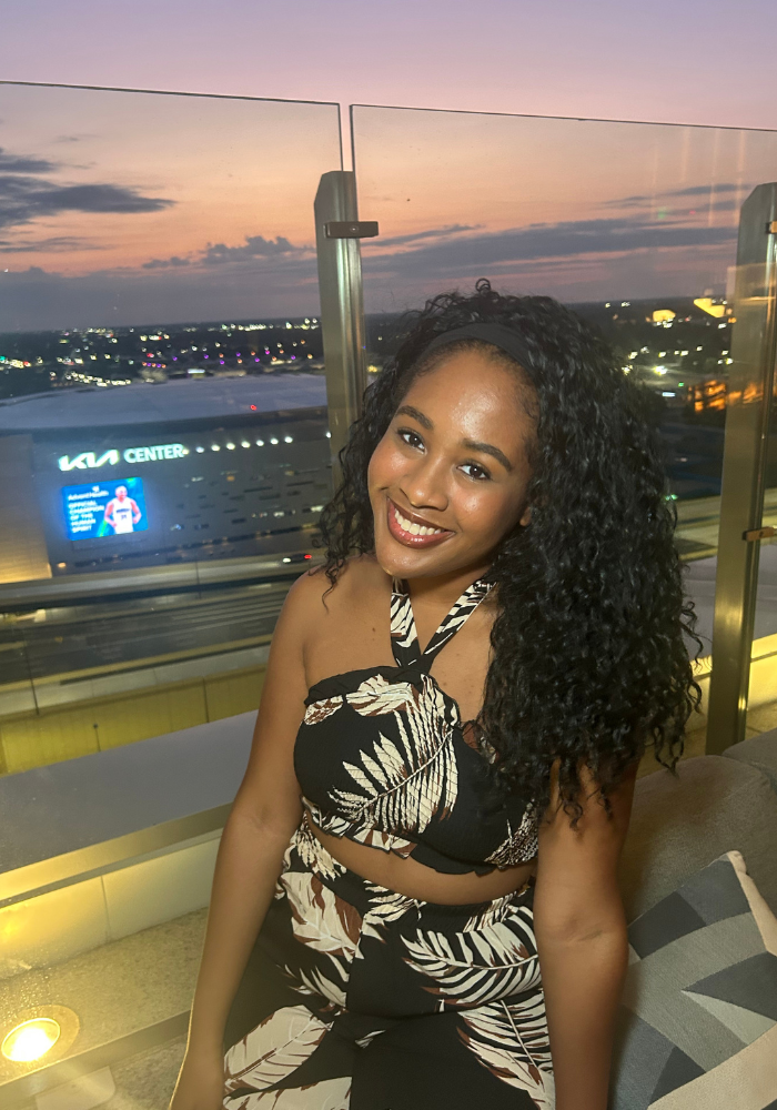 A high school junior is outside enjoying her summer and thinking about applying for scholarships for high school juniors and she is also looking for scholarships to complete over summer break